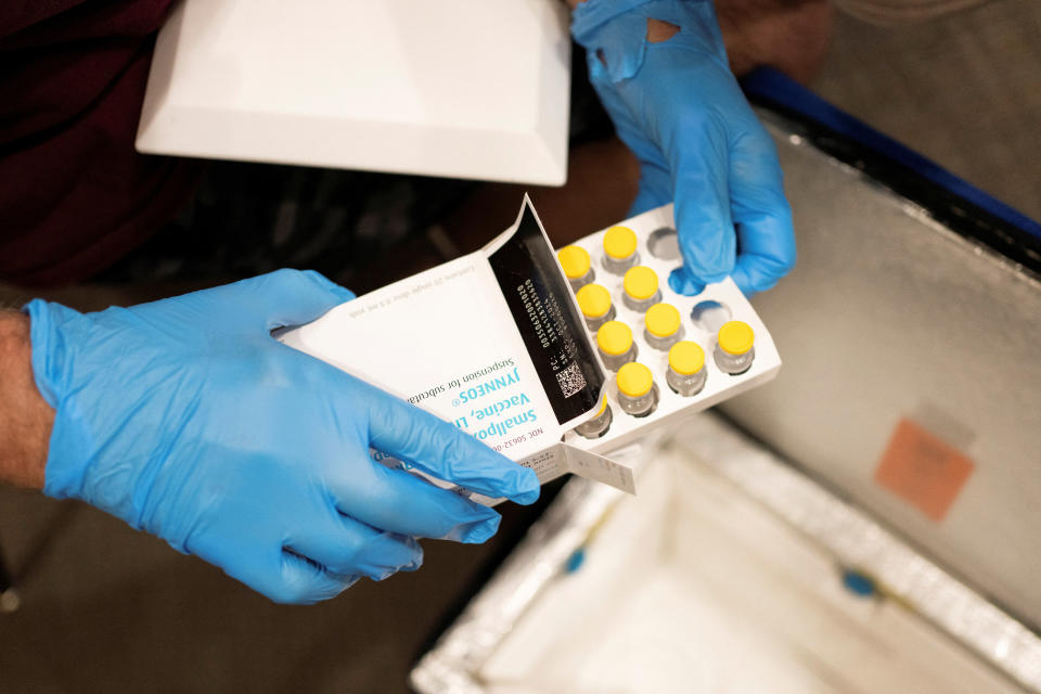 Volunteer pharmacist Foster Knutson retrieves vials of the JYNNEOS smallpox and monkeypox vaccine from a cooler during a clinic through the Pima County Department of Public Health at Abrams Public Health Center in Tucson, Arizona, U.S., August 20, 2022.  REUTERS/Rebecca Noble