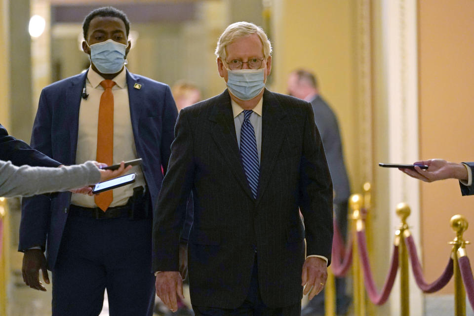 Senate Majority Leader Mitch McConnell of Ky., walks past reporters on Capitol Hill in Washington on Dec. 15, 2020. (Susan Walsh/AP)