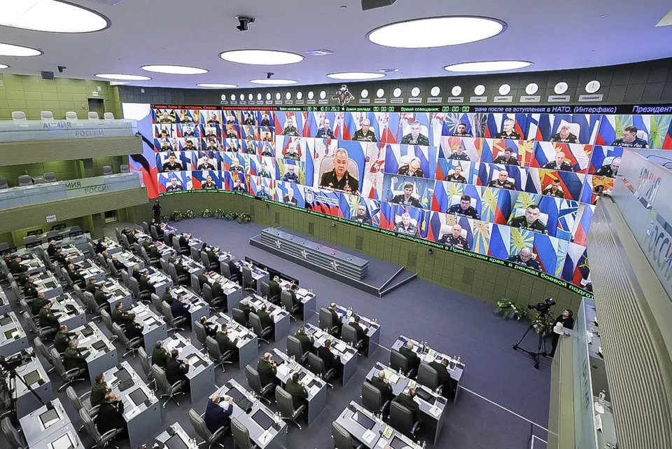 In this handout photo released by Russian Defense Ministry Press Service on Tuesday, Jan. 10, 2023, Russian Defense Minister Sergei Shoigu is seen on the screen as he speaks during a meeting with Russian high level officers in Moscow, Russia. (Russian Defense Ministry Press Service via AP)
