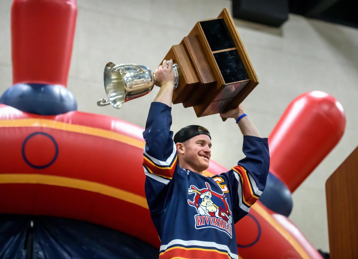 Rivermen captain Alec Hagaman hoists the SPHL President's Cup as he's introduced at a public celebration for the team's championship Friday, May 3, 2024 at the Peoria Civic Center. The Peoria-born player was the MVP of the SPHL playoffs in his final year of professional hockey.