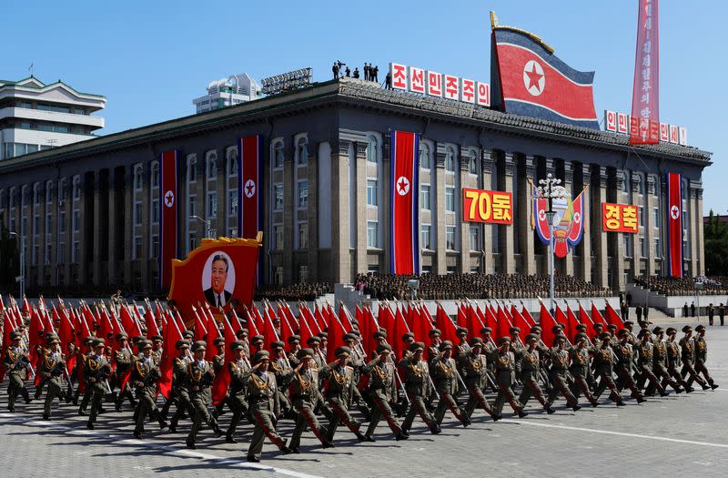 FILE PHOTO: Soldiers march with the portrait of North Korean founder Kim Il Sung during a military parade marking the 70th anniversary of country's foundation in Pyongyang