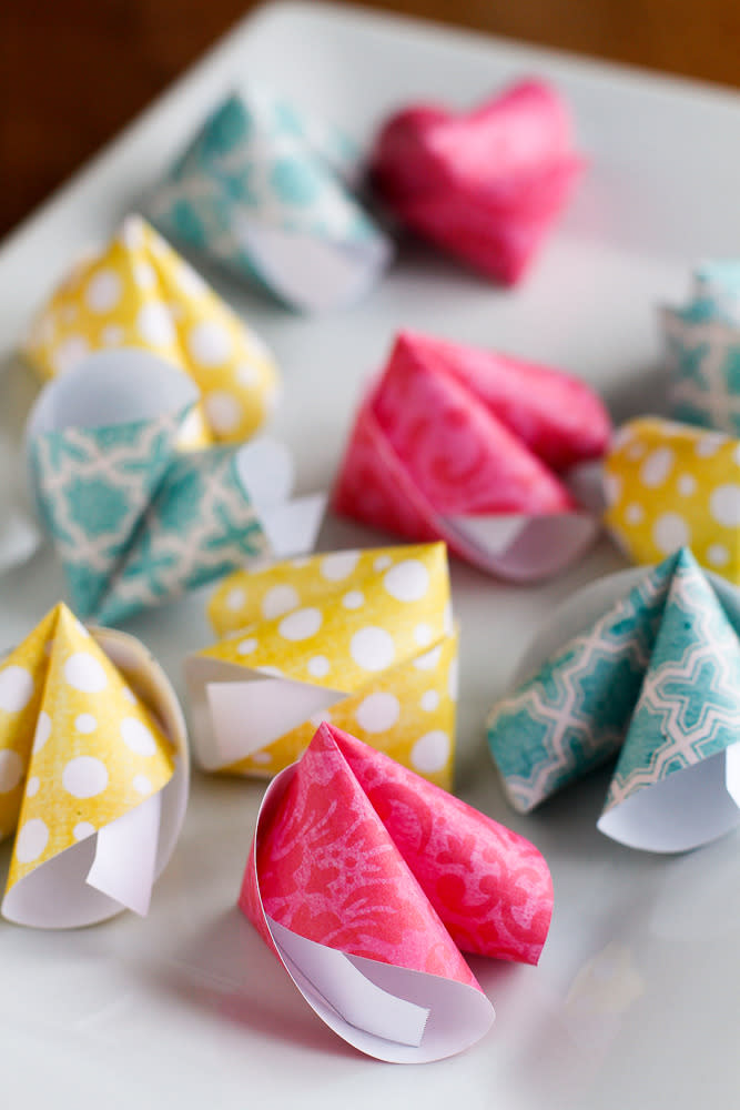 Colourful paper fortune cookies with love notes