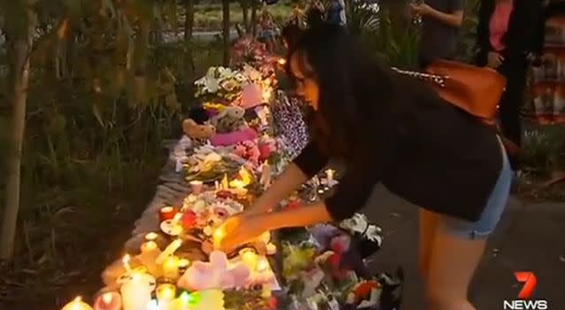 More than 200 people paid tribute to the Brisbane infant at a vigil near the family's home in the suburb of Parkinson. Photo: 7News