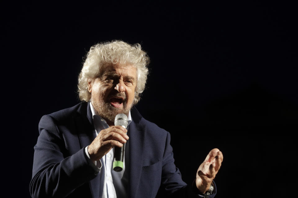 FILE - In this Saturday, Nov. 26, 2016 file photo, Beppe Grillo speaks at a rally in Rome. Former Italian Premier Giuseppe Conte took to task the founder of the 5-Star Movement founder for a video message defending his son against allegations of sexual assault. Conte, a lawyer by training who has been tapped as the next leader of the movement, said in a statement that he understands "the anguish of a father, but we cannot overlook that there are also other people in this affair, who must be protected and whose feelings must be absolutely respected, namely the young girl directly involved in the affair." (AP Photo/Gregorio Borgia, File)