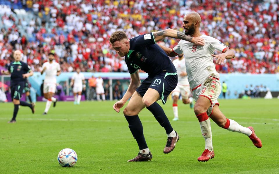 Harry Souttar of Australia battles for possession with Issam Jebali of Tunisia during the FIFA World Cup Qatar 2022 Group D match between Tunisia and Australia at Al Janoub Stadium on November 26, 2022 in Al Wakrah, Qatar - Catherine Ivill/Getty Images