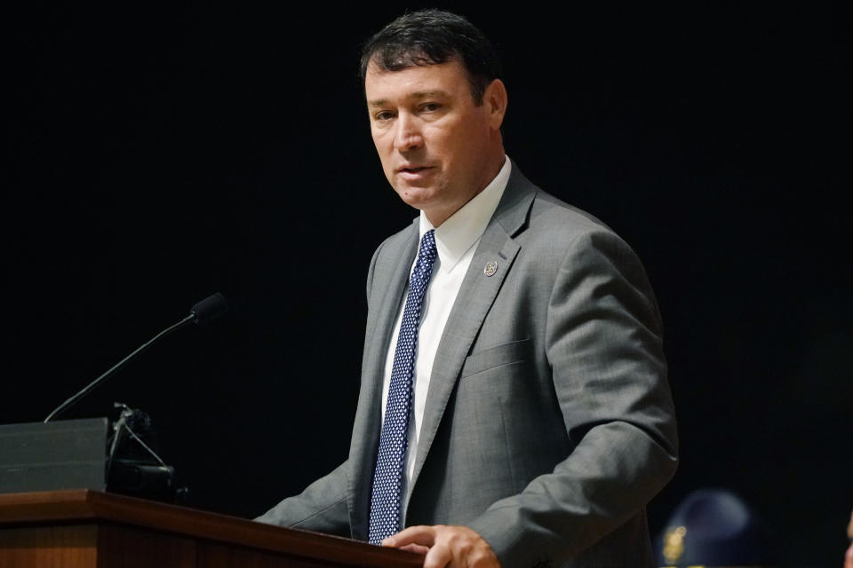 FILE - Mississippi Department of Public Safety Commissioner Sean Tindell delivers remarks during the Mississippi Highway Safety Patrol's Cadet Class 65 graduation ceremony, June 30, 2021, in Pearl, Miss. Tindell is a former Mississippi Court of Appeals judge who stepped into his role _ overseeing the state medical examiner’s office, the highway patrol and other agencies _ in May 2020. He called the backlog “unacceptable” and said he's made eliminating it the top priority of his administration. (AP Photo/Rogelio V. Solis)