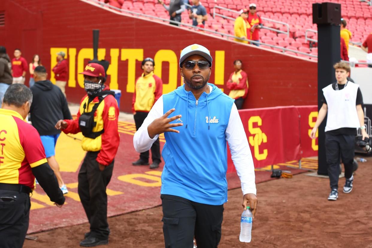 UCLA athletic director Martin Jarmond gestures before the Bruins' win over USC at the Coliseum on Nov. 18.