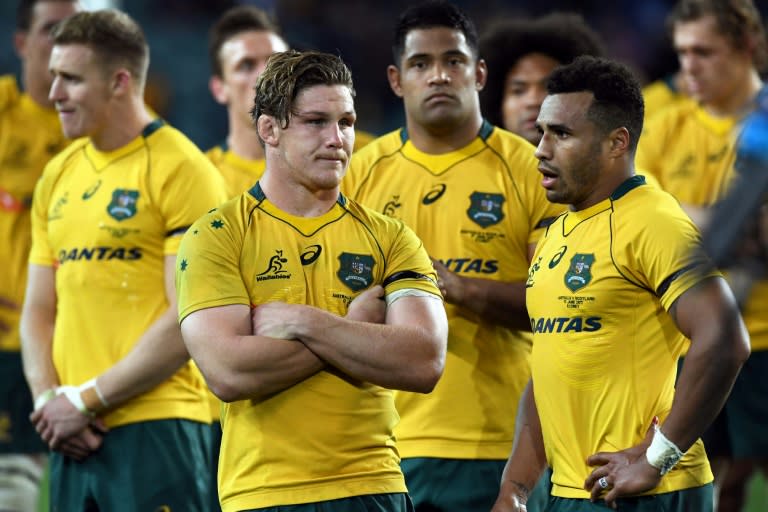 Australian Wallabies' captain Michael Hooper (front L) and teammates, seen after their loss to Scotland, in Sydney, on June 17, 2017