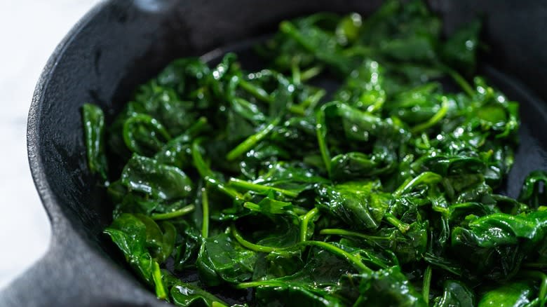 sauteeing spinach in pan