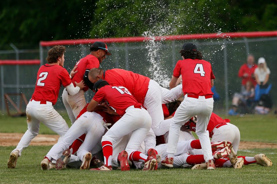 Westerville South players celebrate their 3-2 win over Hilliard Darby to win the Div. I district final at South on Wednesday, May 26, 2021. 