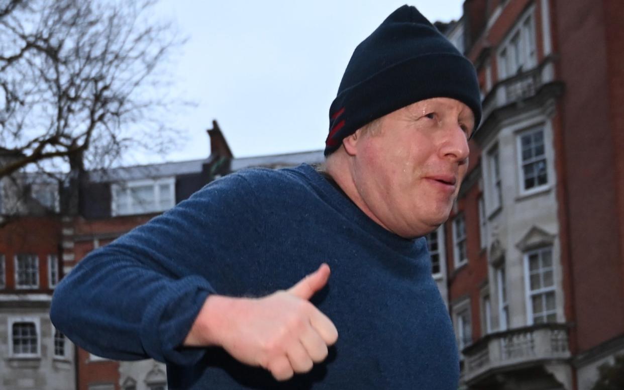 Boris Johnson, seen jogging on Wednesday morning, voted against Rishi Sunak’s deal - Eddie Mulholland for The Telegraph