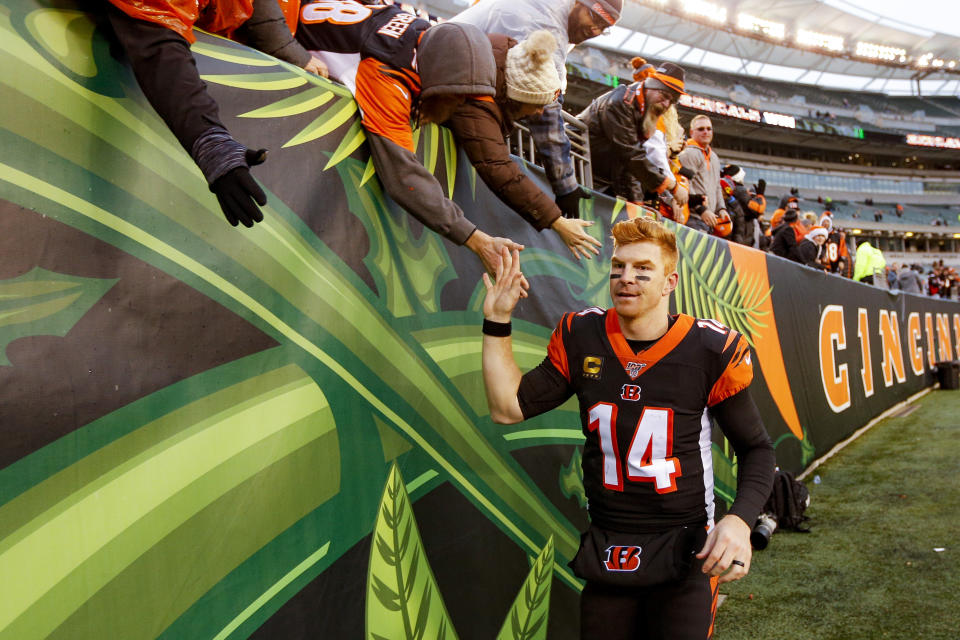 Cincinnati Bengals quarterback Andy Dalton (14) celebrates with fans after an NFL football game against the New York Jets, Sunday, Dec. 1, 2019, in Cincinnati. (AP Photo/Frank Victores)
