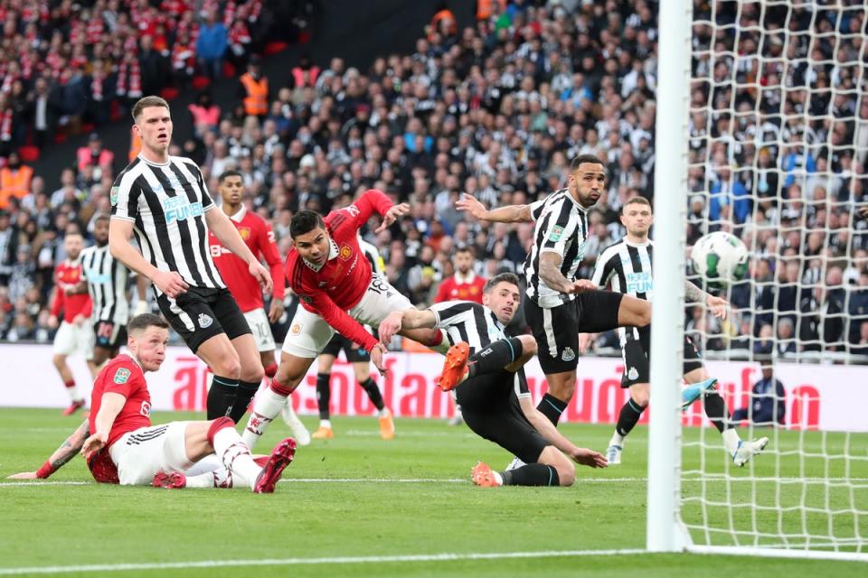 Casemiro gets amongst Newcastle defenders to score Manchester United’s opener (AP)