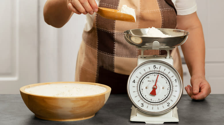 woman weighing flour