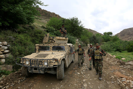 Afghan Special Forces patrol at the site of a MOAB, or ''mother of all bombs'', which struck the Achin district of the eastern province of Nangarhar, Afghanistan April 23, 2017. REUTERS/Parwiz