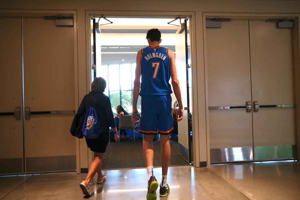 Chet Holmgren (7) is led out of the exhibit hall to another interview area at Thunder Media Day, held in the Oklahoma City Convention Center on Monday, Oct. 2, 2023.