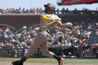 San Diego Padres' Fernando Tatis Jr. hits a single against the San Francisco Giants during the sixth inning of a baseball game in San Francisco, Saturday, May 8, 2021. (AP Photo/Jeff Chiu)