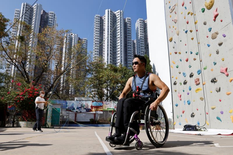 Lai Chi-wai, a paraplegic climber, attends a training session, ahead of his climb on the 320-metre tall Nina Tower using only his upper body strength, in Hong Kong