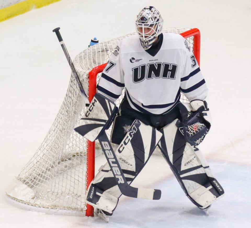 University of New Hampshire goalie Jakob Hellsten makes a save against Princeton University in a game last month at the Whittemore Center. Hellsten has a 9-6-1 record with a 1.94 goals-against average this season, his first with the Wildcats.