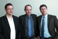 German Dr. Gero Hutter, left, Timothy Ray Brown, center, and Washington University Dr. David Curiel pose for a picture after Hutter discussed his treatment of Brown at a symposium on gene therapy cures at Washington University on Wednesday, Sept. 12, 2012, in St. Louis. Brown was diagnosed with HIV in 1995. In 2007 he had a blood gem cell transplant to treat leukemia using a donor with a rare gene mutation that provides natural resistance to HIV. Hutter says that resistance transferred to Brown and that enough time has passed to say without hesitation that he is cured of HIV. (AP Photo/Jim Salter)