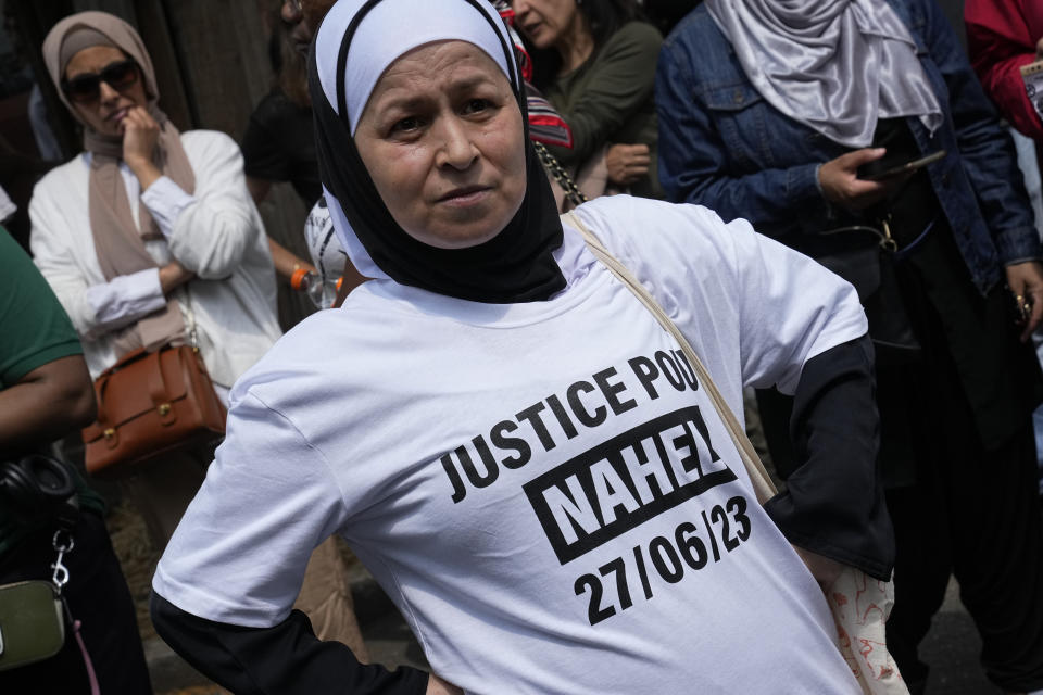 FILE - A demonstrator wears a T-shirt reading "Justice for Nahel" during a march Thursday, June 29, 2023 in Nanterre, outside Paris. Officially, race doesn't exist in France. But the killing of the French-born 17-year-old with North African roots has again exposed deep feelings about systemic racism that lie under the surface of the country's ideal of color-blind equality. (AP Photo/Michel Euler, File)