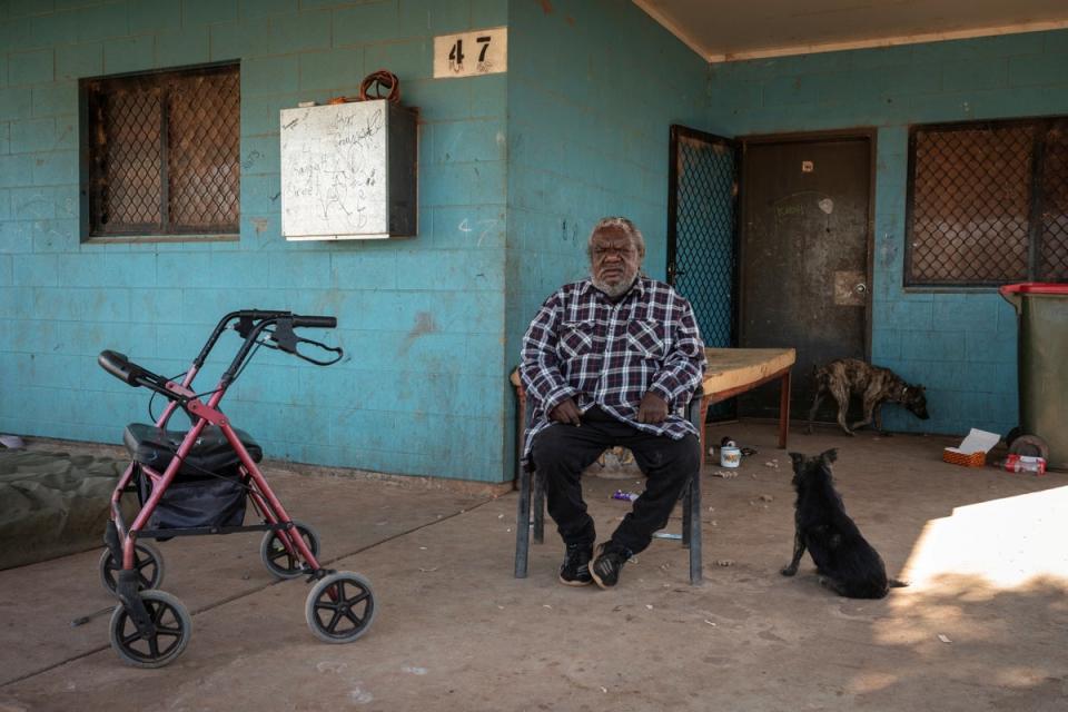 Retiree Patrick Oliver, 70, poses for a photo on the front porch of his home in Hermannsburg (Reuters)