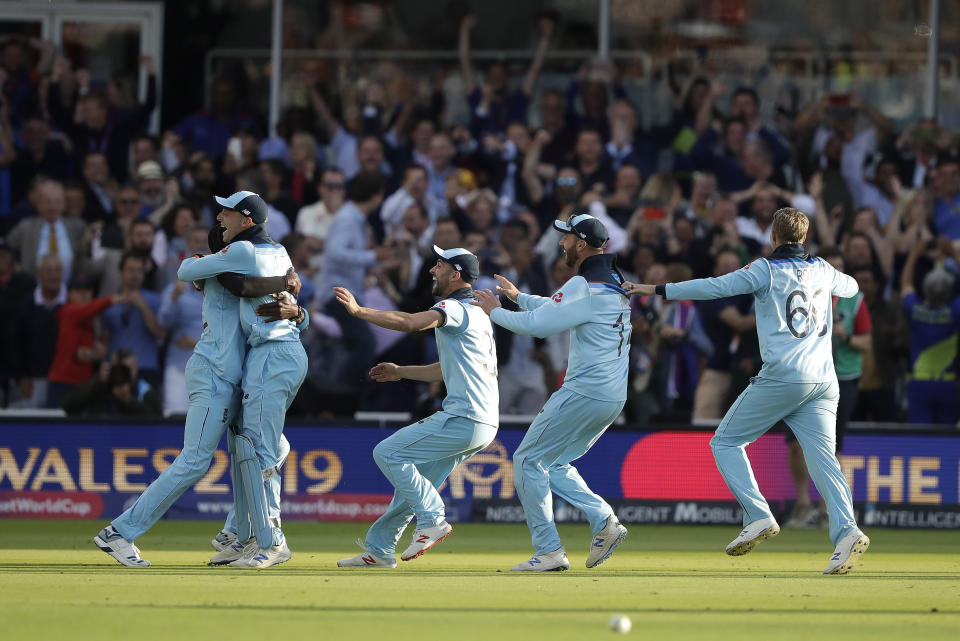 England players celebrate after winning the Cricket World Cup final match between England and New Zealand at Lord's cricket ground in London, Sunday, July 14, 2019. England won after a super over after the scores ended tied after 50 overs each. (AP Photo/Matt Dunham)