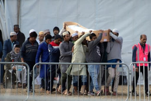 Mourners prepare to bury one of the victims of the Christchurch shootings on Friday, a week after a gunman shot dead 50 worshippers