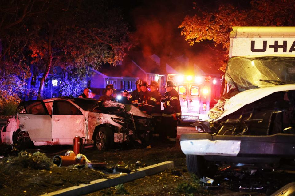 Firefighters at the scene of a fatal crash near 885 Centre St. in Brockton on Wednesday, Nov. 17, 2021.