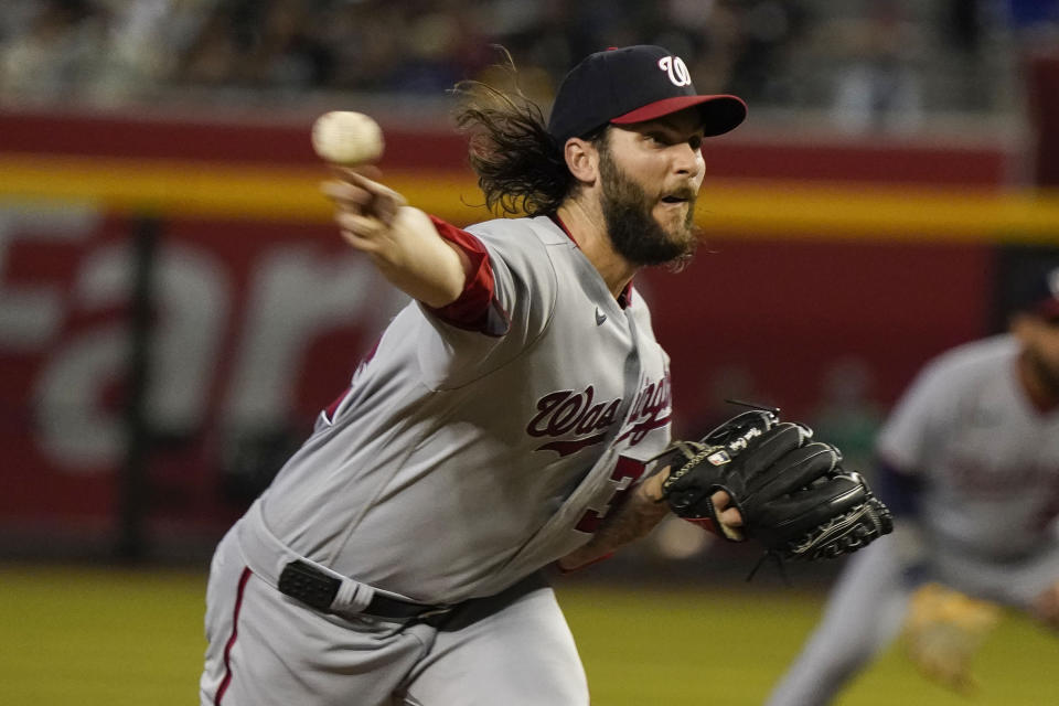 Washington Nationals pitcher Trevor Williams throws against the Arizona Diamondbacks in the first inning during a baseball game, Sunday, May 7, 2023, in Phoenix. (AP Photo/Darryl Webb)