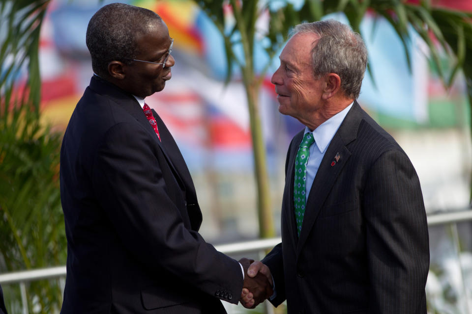 New York mayor Michael R. Bloomberg, right, and Babatunde Fashola of Lagos, shake hands during the UN Conference on Sustainable Development, or Rio+20, in Rio de Janeiro, Brazil, Tuesday, June 19, 2012. While squabbling between rich and poor countries threatens to derail the Earth summit, the world’s mayors say they can't afford the luxury of endless, fruitless negotiations and are already taking real action to stave off environmental disaster and preserve natural resources for future generations. (AP Photo/Felipe Dana)