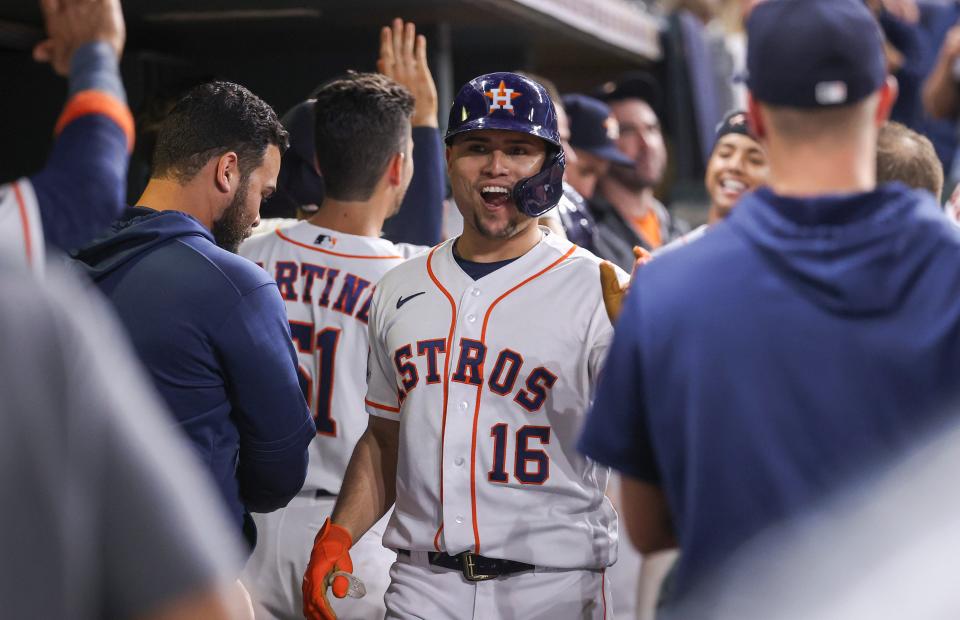 Houston Astros second baseman Aledmys Diaz (16) celebrates in the dugout after hitting a home run against the Oakland Athletics at Minute Maid Park on Sept. 15, 2022.