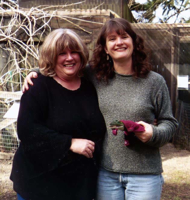The author and her mother at the Cascade Raptor Center in Eugene, Oregon, in 2005, posing with the plastic costumed alligator they traded back and forth for 25 years (Photo: Courtesy of Melissa Hart)
