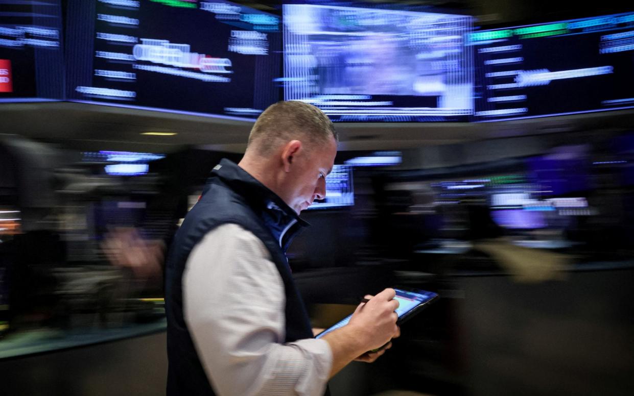 A trader on the floor of the New York Stock Exchange in March