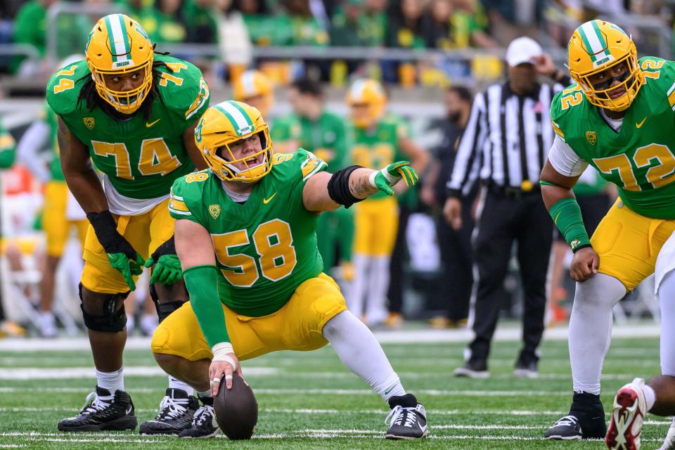 Oregon Ducks offensive lineman Jackson Powers-Johnson (58) signals against the Washington State Cougars in the 4th quarter at Autzen Stadium in Eugene, Oregon, on Oct. 21, 2023.