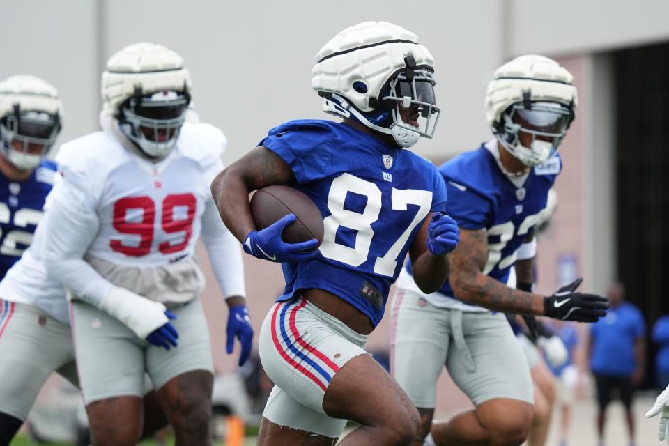 Jul 25, 2024; East Rutherford, NY, USA; New York Giants wide receiver Isaiah McKenzie (87) carries a ball during training camp at Quest Diagnostics Training Center. Mandatory Credit: Lucas Boland-USA TODAY Sports