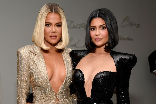 <p>Kevin Mazur/Getty Images</p> Khloé Kardashian and Kylie Jenner at Sean Combs' 50th Birthday Bash in December 2019