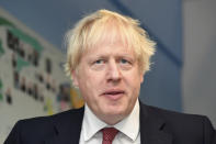 Britain's Prime Minister Boris Johnson visits Pimlico Primary school in London, Tuesday July 10, 2018, with Education Secretary Gavin Williamson to meet staff and students. (Toby Melville/Pool via AP)