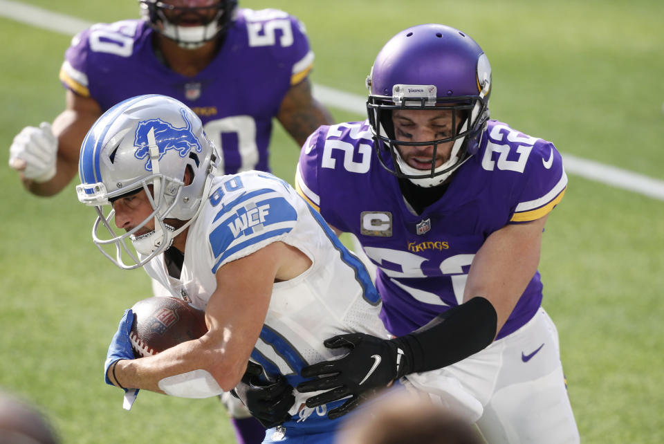 FILE - In this Nov. 8, 2020, file photo, Detroit Lions wide receiver Danny Amendola (80) tries to break a tackle by Minnesota Vikings safety Harrison Smith (22) after catching a pass during the first half of an NFL football game in Minneapolis. The Vikings have signed five-time Pro Bowl safety Smith to a contract extension Sunday, Aug. 29, 2021, securing the team's longest-tenured player for what could be the remainder of his career. (AP Photo/Bruce Kluckhohn, File)