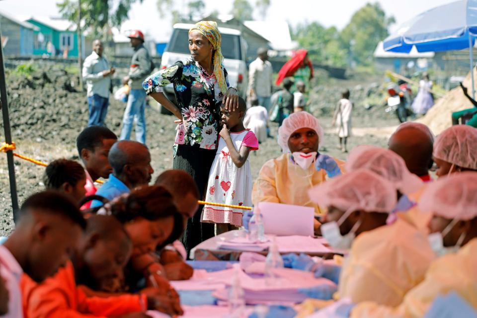 A woman awaits an Ebola vaccination in DRC.