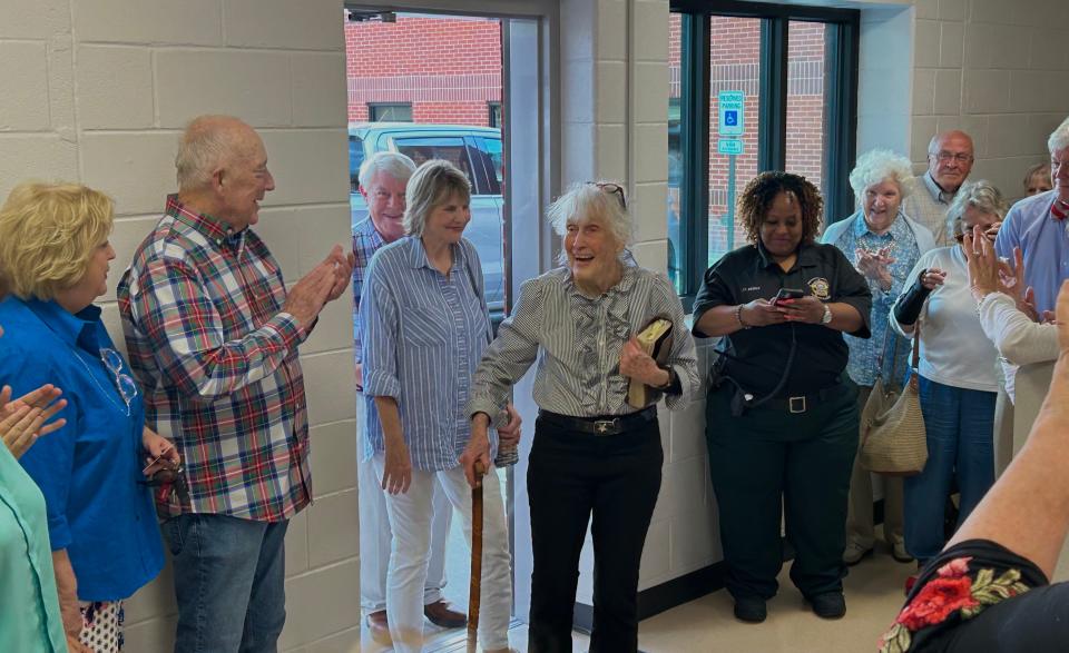 Cornelia Tiller (Ms. Happy) walks into a surprise dedication ceremony in her honor at the Madison County Jail Visitation Center in Jackson, Tenn., on May 16, 2023.