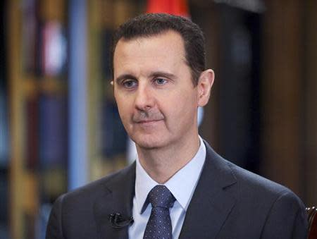 Syria's President Bashar al-Assad speaks during an interview with Venezuelan state television TeleSUR in Damascus, in this handout photograph distributed by Syria's national news agency SANA on September 26, 2013. REUTERS/SANA/Handout via Reuters