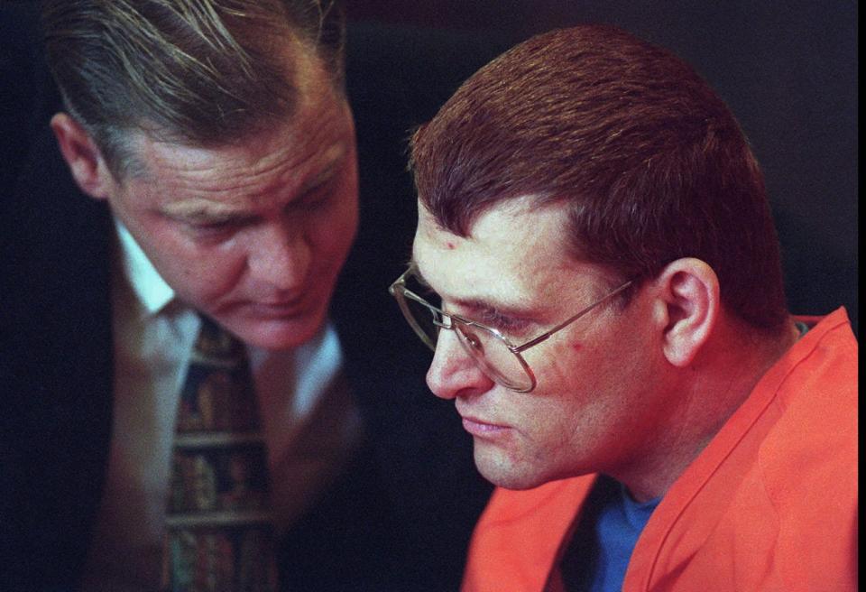 Accused murderer Keith Hunter Jesperson, 40, right, listens to his attorney Tom Phelan, left, moments before pleading guilty to murder charges Wednesday Oct. 18, 1995, at the Clark County Courthouse in Vancouver, Wash.