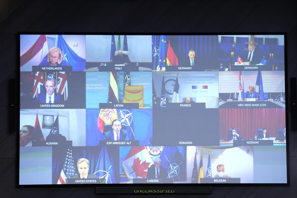 A screen displays NATO Foreign Ministers as they listen to NATO Secretary General Jens Stoltenberg during a video meeting following developments in Afghanistan at the NATO headquarters in Brussels, Friday, Aug. 20, 2021. (AP Photo/Francisco Seco, Pool)