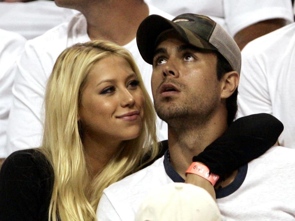 Anna Kournikova and Enrique Iglesias attend NBA basketball playoffs between the New Jersey Nets and the Miami Heat, Miami, Florida, photo