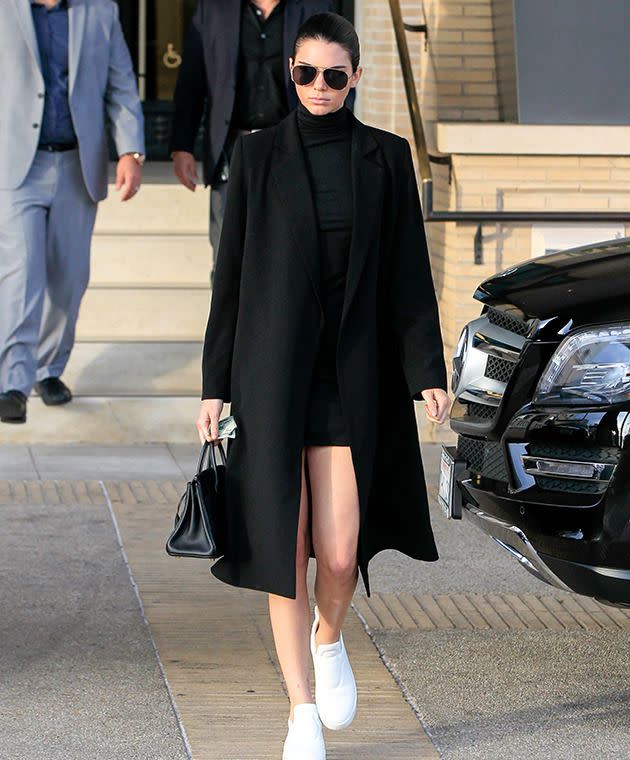 In December, Jenner stepped out in this black, TY-LR coat.