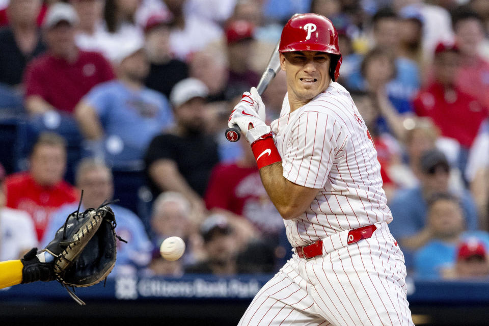 Philadelphia Phillies' J.T. Realmuto is hit by a pitch from Milwaukee Brewers' Colin Rea during the fifth inning of a baseball game Tuesday, June 4, 2024, in Philadelphia. (AP Photo/Laurence Kesterson)