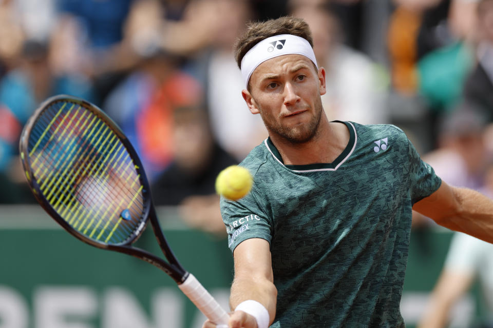 Norway's Casper Ruud plays a shot against Finland's Emil Ruusuvuori during their second round match at the French Open tennis tournament in Roland Garros stadium in Paris, France, Thursday, May 26, 2022. (AP Photo/Jean-Francois Badias)