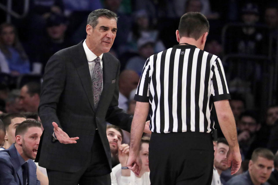 Villanova head coach Jay Wright, left, talks to referee Pat Driscoll during the first half of an NCAA college basketball game against Seton Hall in the championship of the Big East Conference tournament, Saturday, March 16, 2019, in New York. Villanova won 74-72. (AP Photo/Julio Cortez)