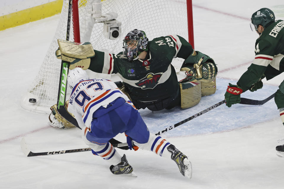 Minnesota Wild goaltender Marc-Andre Fleury (29) blocks a shot by Edmonton Oilers center Ryan Nugent-Hopkins (93) during the third period of an NHL hockey game Thursday, Dec. 1, 2022, in St. Paul, Minn. (AP Photo/Stacy Bengs)